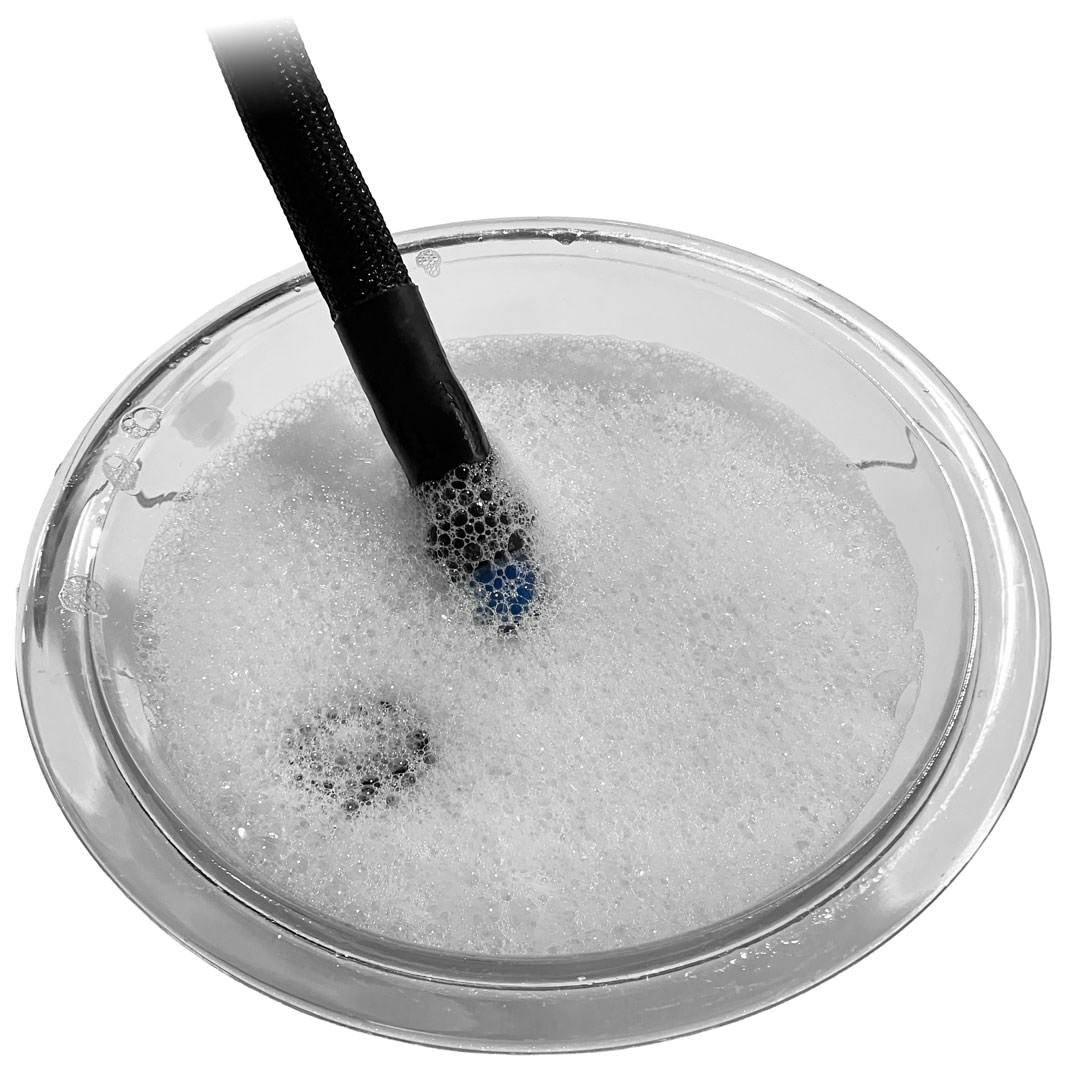 Cleaning the Ever Sip in a bowl of soapy water
